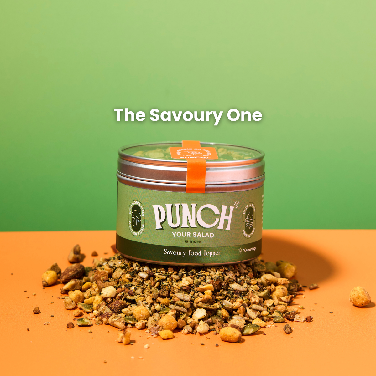 Punch salad topper container with savory food on an orange surface and green background