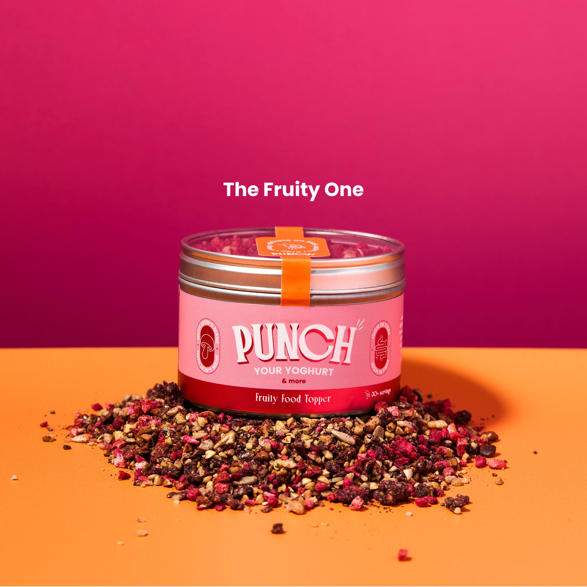 Pink container labeled 'Punch' with dried fruits on a pink and orange background