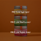 Three stacked cylindrical yogurt containers on a warm brown background, each with a different flavor label: yellow 'PUNCH your Eggs (spicy)', green 'PUNCH your Salad (savory)', and pink 'PUNCH your Yoghurt (fruity)'.