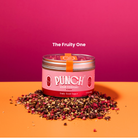 Pink container labeled 'Punch' with dried fruits on a pink and orange background