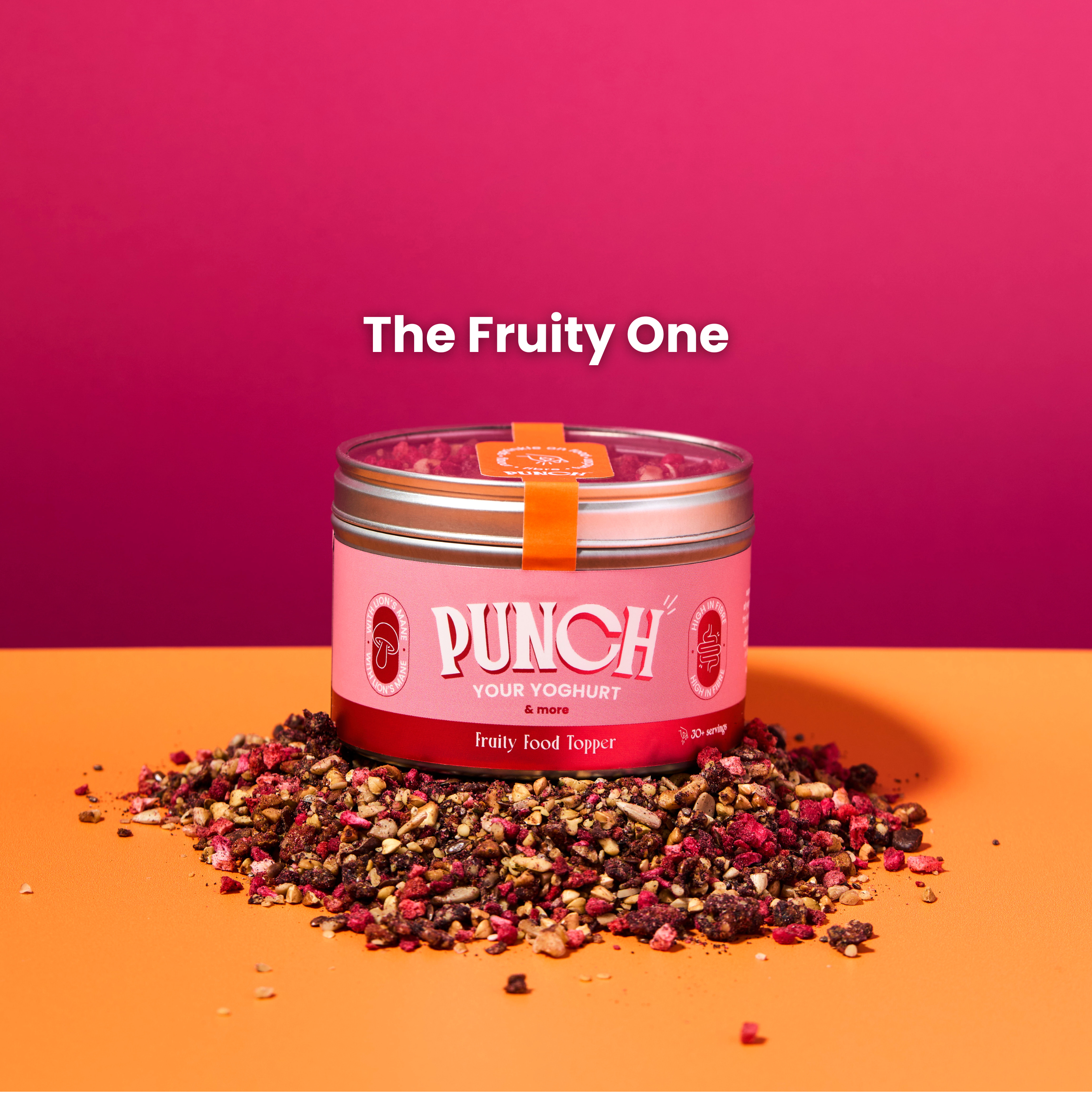 Pink container labeled 'Punch' with dried fruits on a pink and orange background